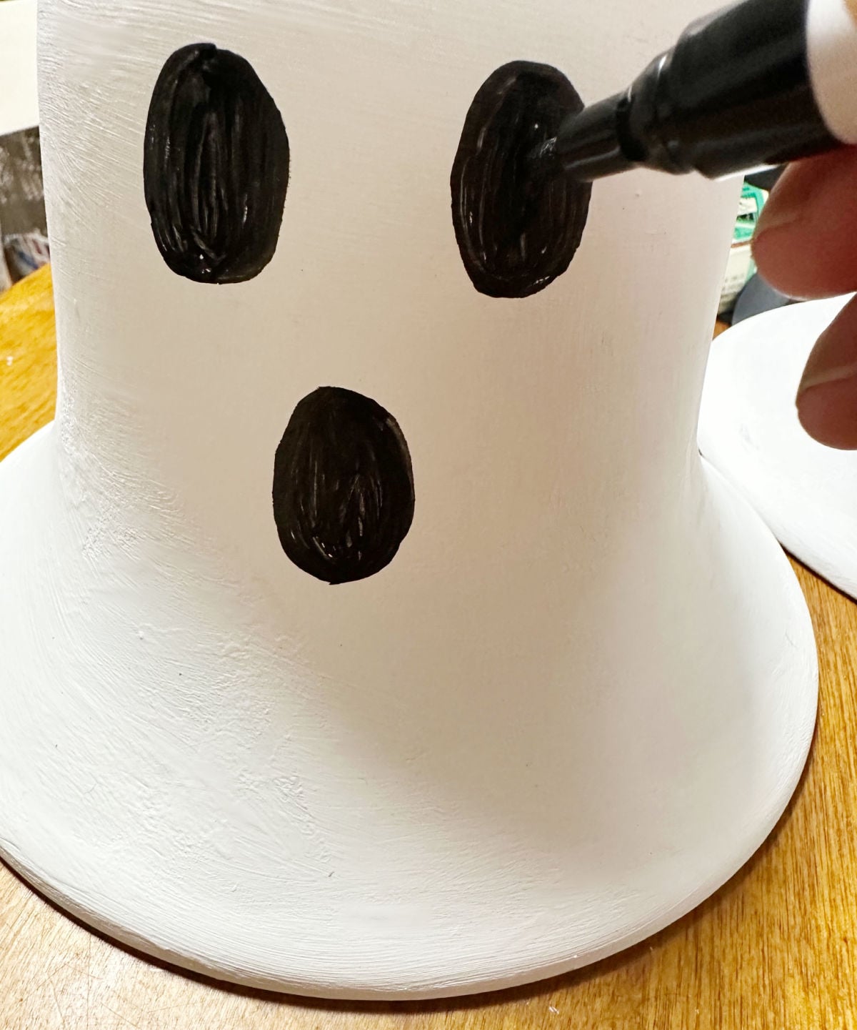 drawing ghost eyes on upcycled lamp shades
