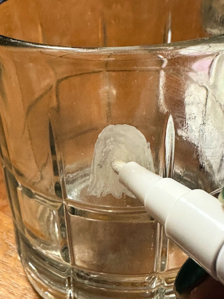 painting a ghost on a glass tumbler
