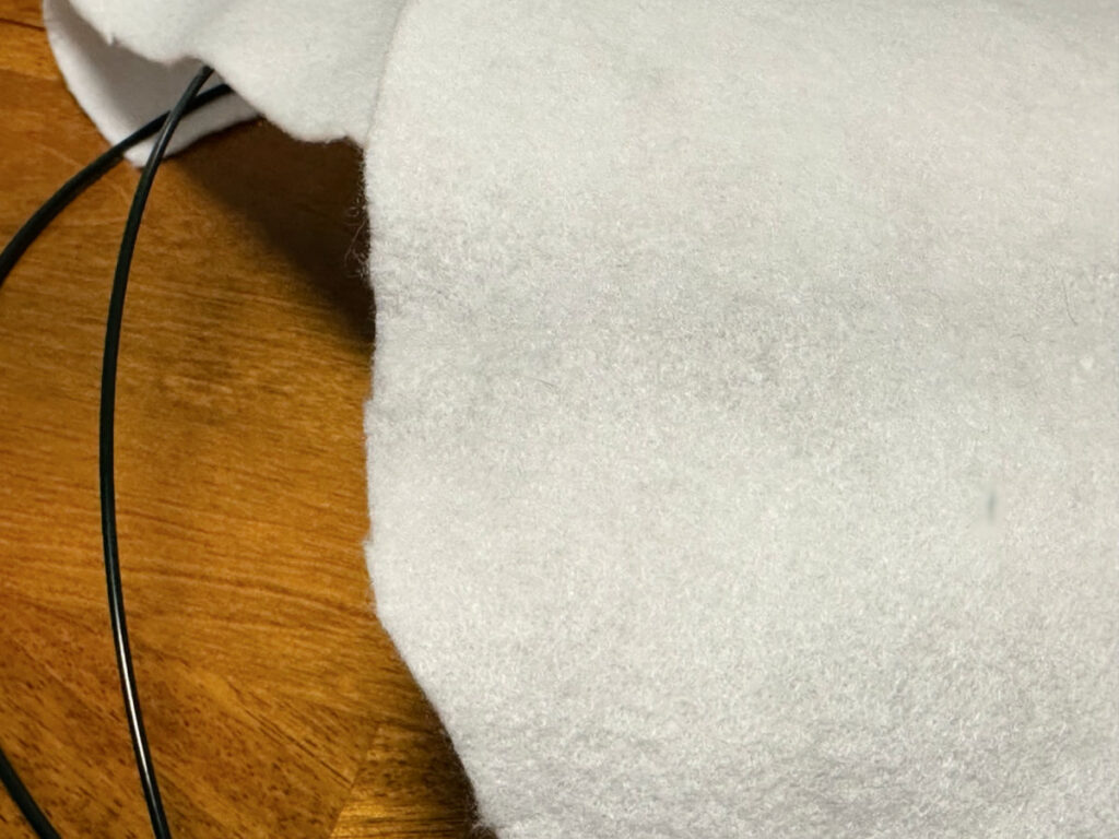 gluing felt to the wire pumpkin