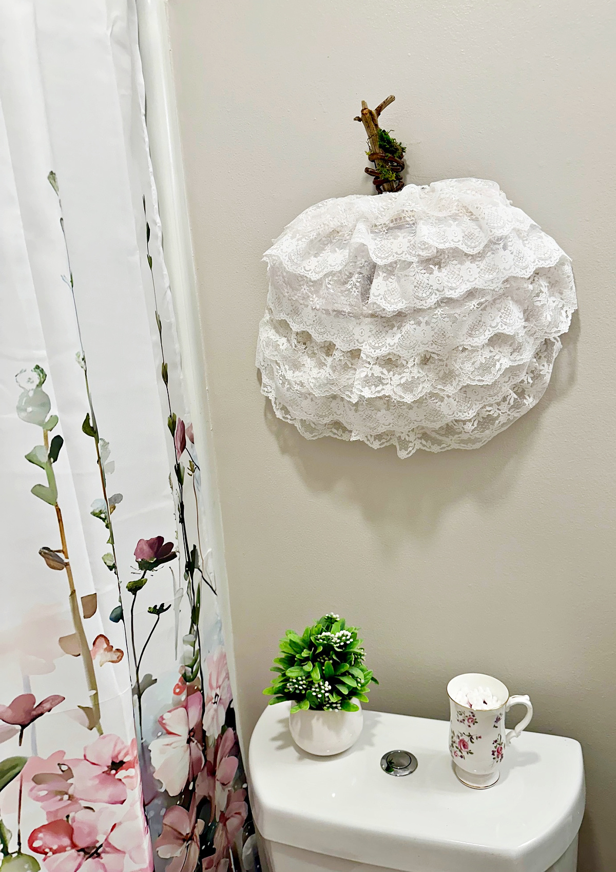 side view of lace pumpkin wreath in bathroom